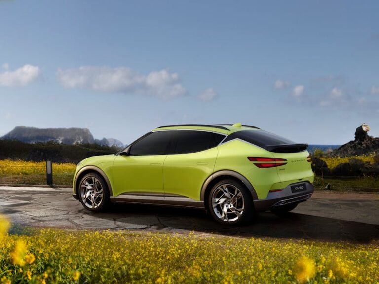 A vibrant lime SUV parked outdoors against a scenic backdrop, perfect for travel and adventure themes.